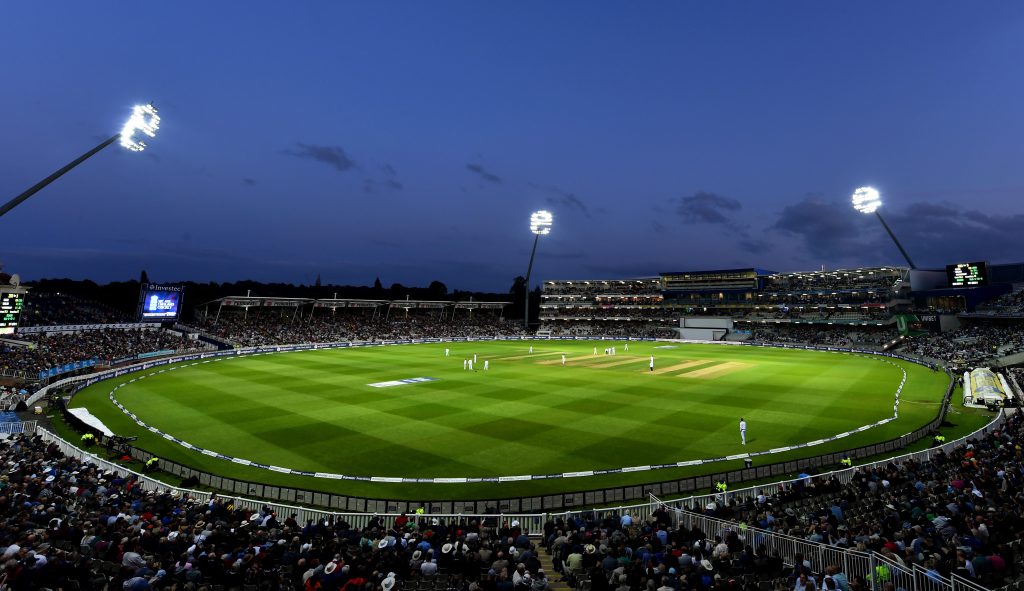 Cricket pitch with floodlights.