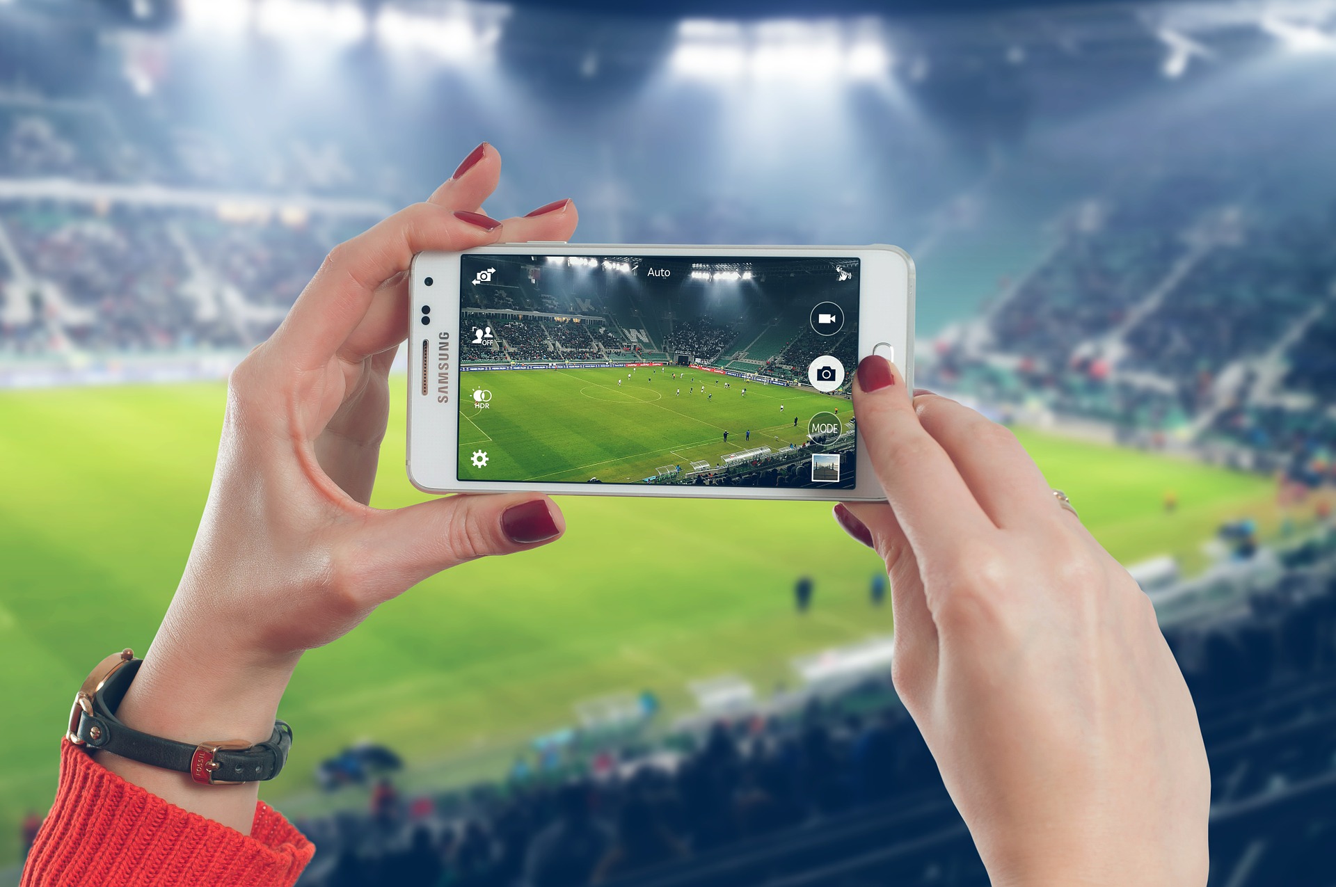 an image of a person streaming a football match on their mobile showcasing various options available for ppc campaigns with active a win a ppc agency in manchester